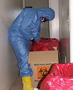 Technician disposing of biohazard waste